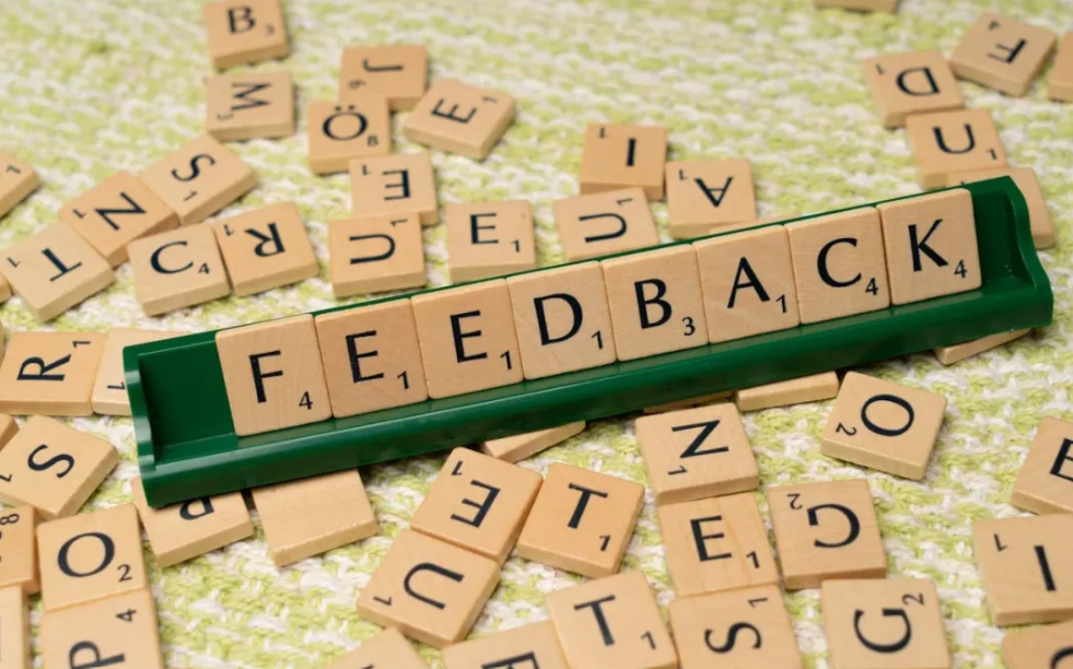 Scrabble tiles spelling “feedback” representing testimonials and customer trust for small businesses
