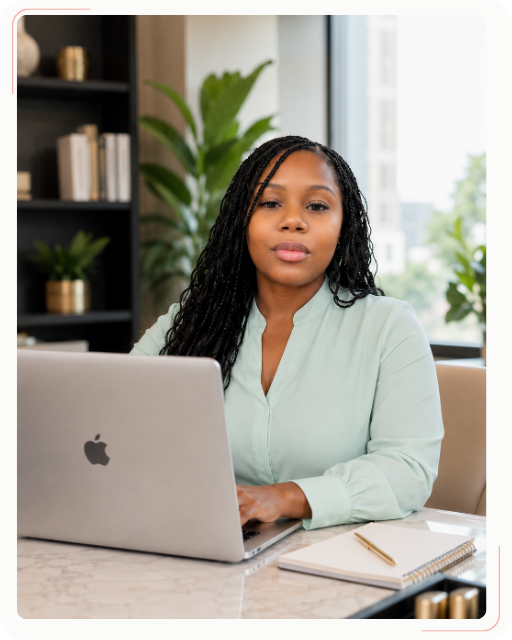 7 Lakeasha Jackson, founder of Watermint Crest, working on web design strategy at her desk